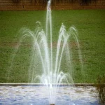 راس نافورة زهرة ثلاثية